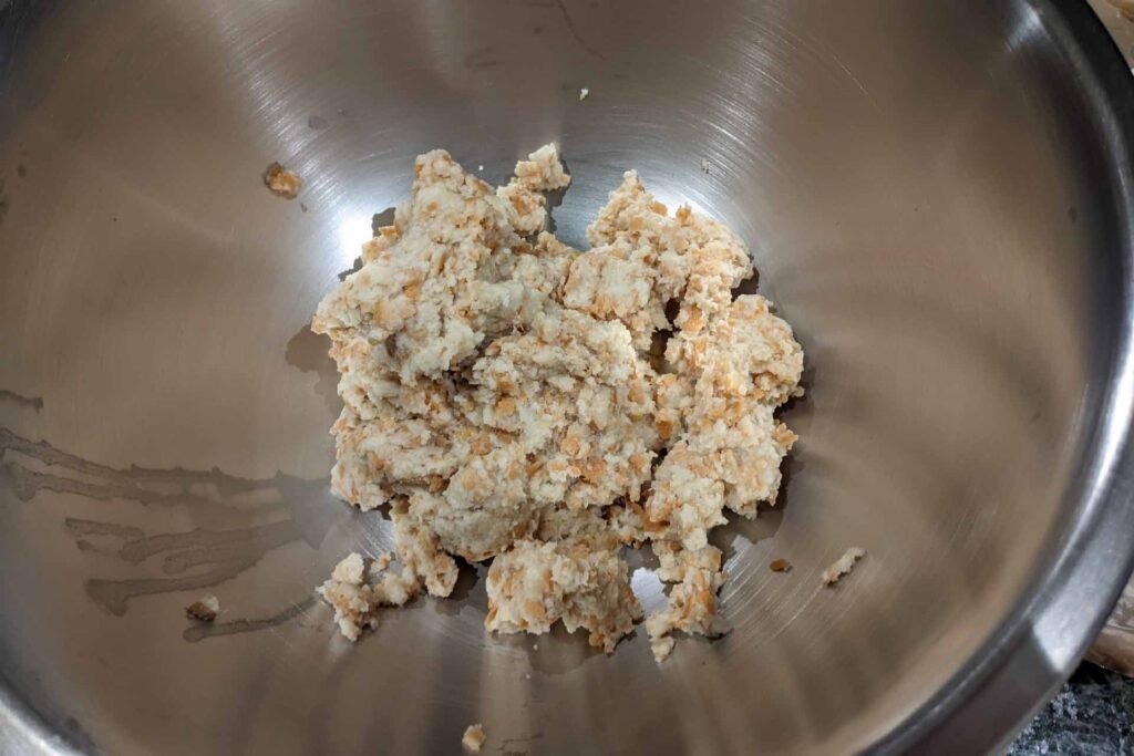 Soaked bread in a mixing bowl