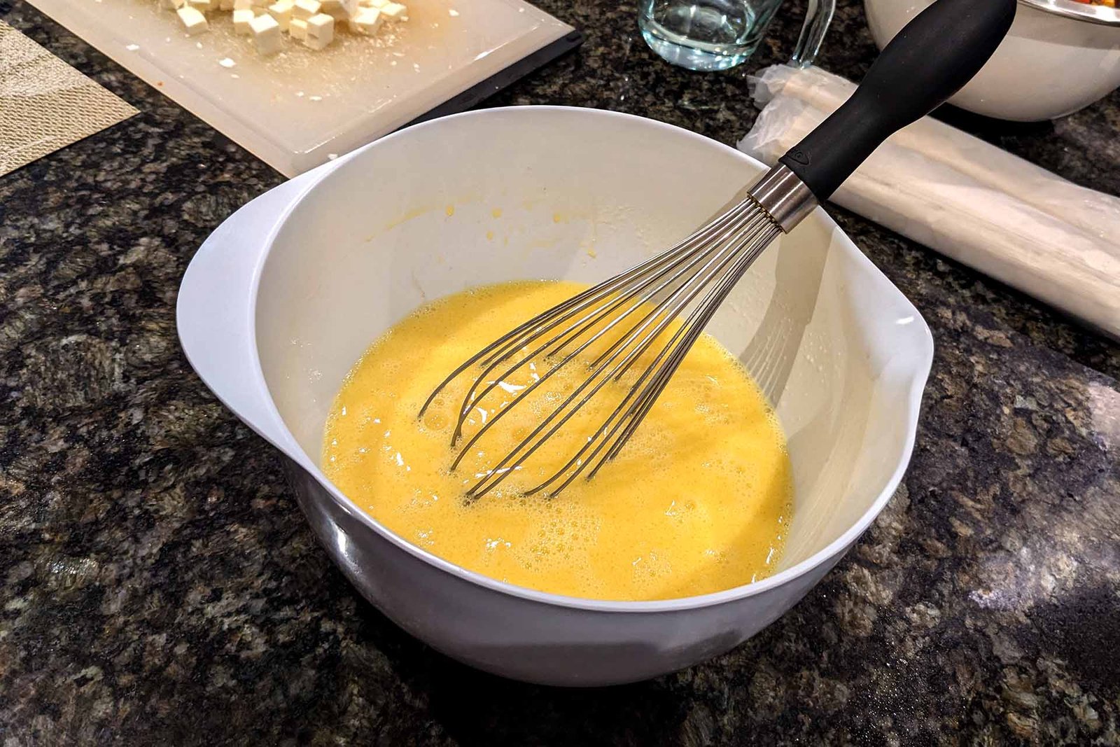 Whisked eggs in a bowl on the counter