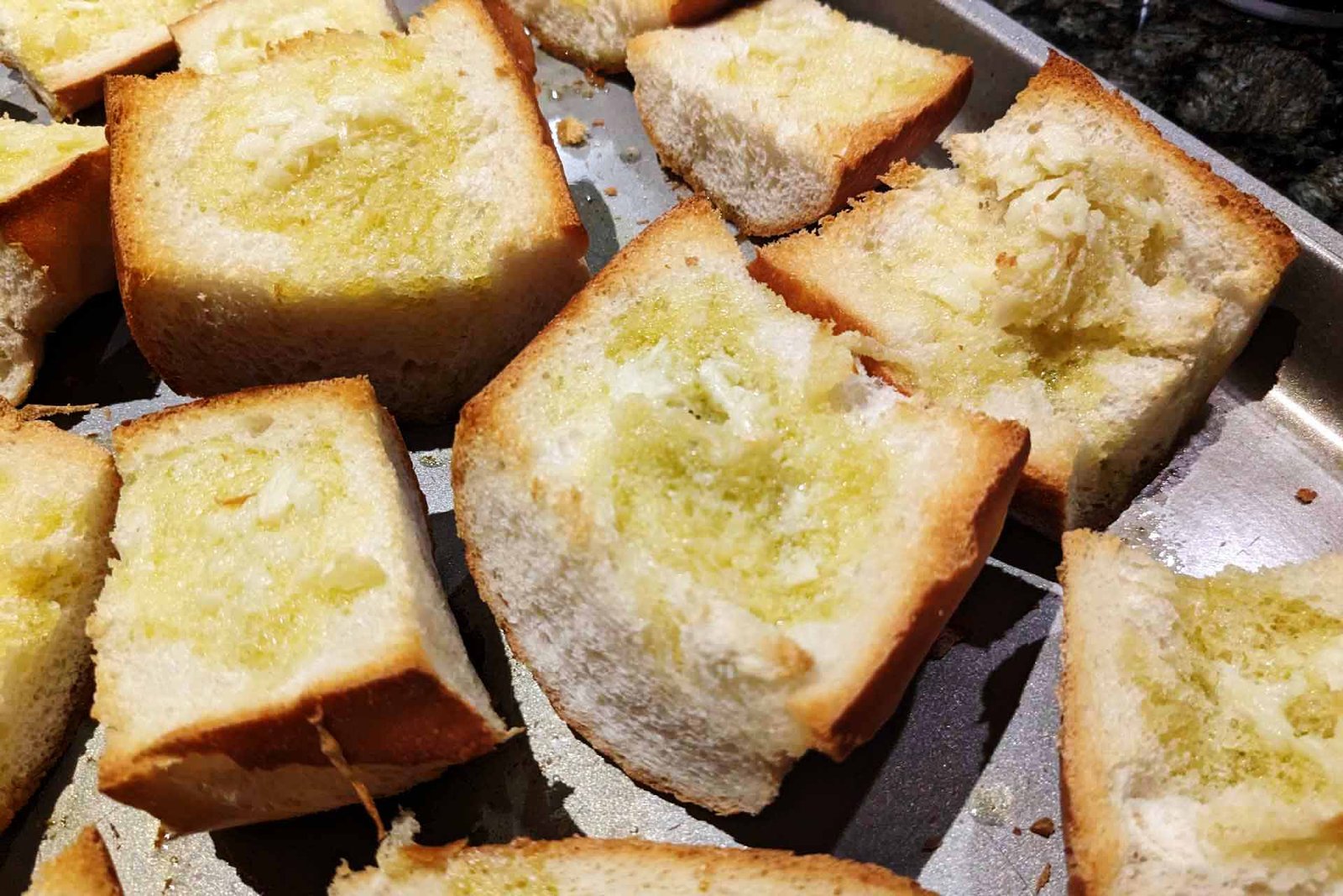 Toasted garlic bread on a baking sheet